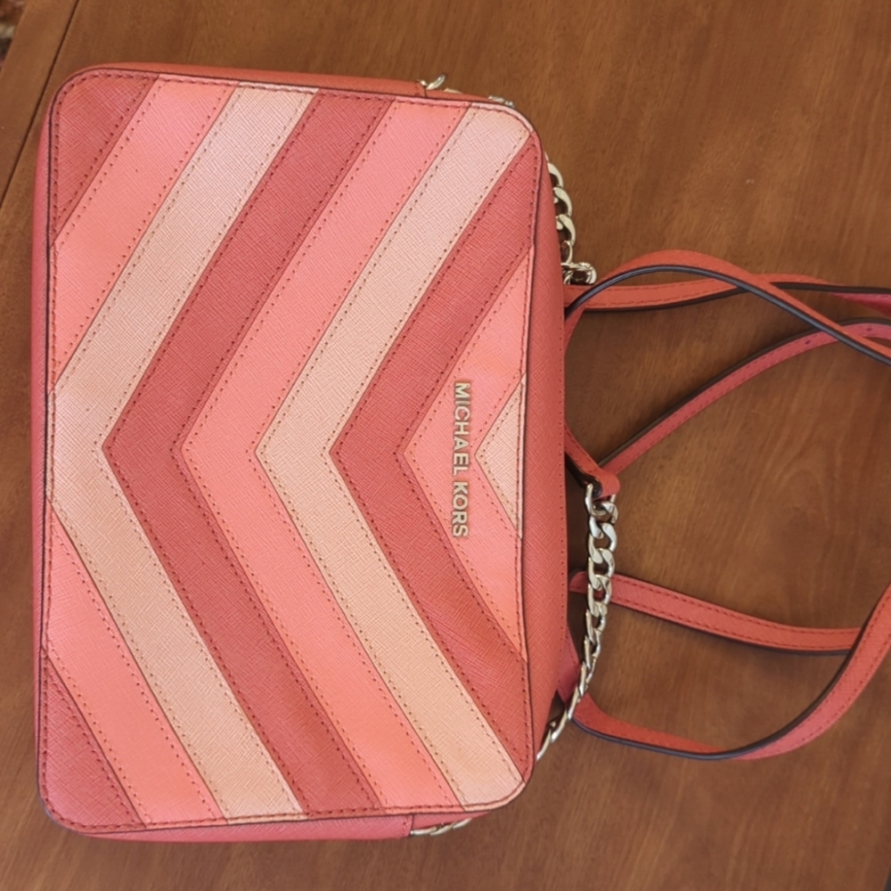 Michael Kors leather hand bag never used. This was a gift. Excellent condition.